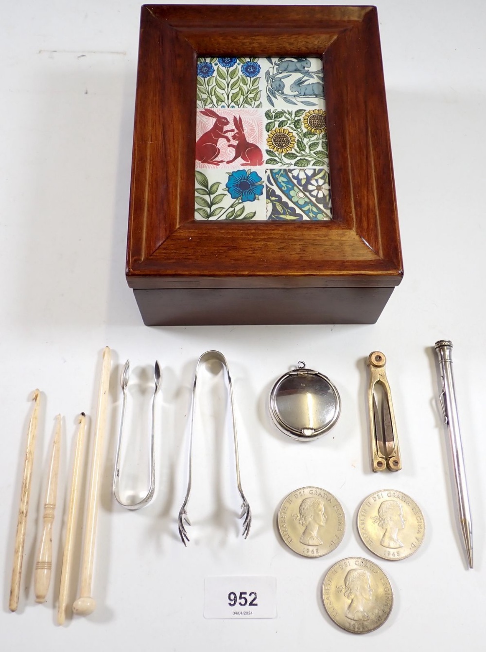 A wooden jewellery box with various collectables including Eversharp pencil, Elizabeth II