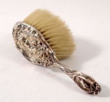 An Edwardian silver baby's hairbrush embossed Art Nouveau woman's head, by Levi & Salaman,