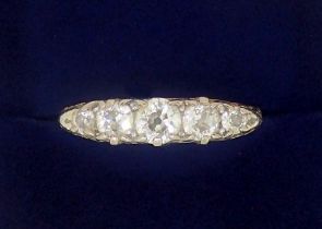 An 18 carat gold five stone diamond ring, size N, 3g