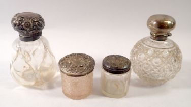 Two Victorian cut glass scent bottles with silver lids and glass stoppers plus two glass and