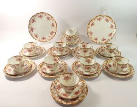 A Victoriain Reids 'Park Place China' tea service comprising nine cups and saucers, two cake plates,