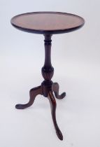 A small mahogany wine table on slender column and triple supports