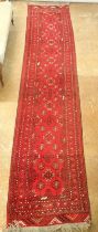 A Turkoman style long red runner, 371 x 82cm