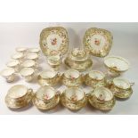 A Rockingham tea service comprising eight tea cups, eight coffee cups, eight saucers, slop bowl,