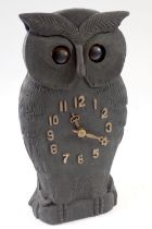 A 20th century Black Forrest carved wooden owl form clock with oscillating eyes, 24.5cm
