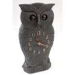 A 20th century Black Forrest carved wooden owl form clock with oscillating eyes, 24.5cm