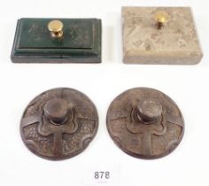 Four various stone and metal paperweights