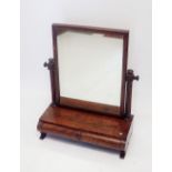 An early 19th century mahogany swing toiletry mirror with drawers to base, 55cm wide