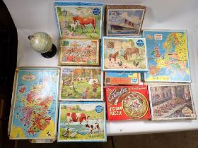 A box of vintage wooden jigsaw puzzles including Victory Boy Scout's Camp, maps, horses etc. plus