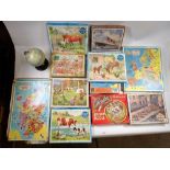 A box of vintage wooden jigsaw puzzles including Victory Boy Scout's Camp, maps, horses etc. plus