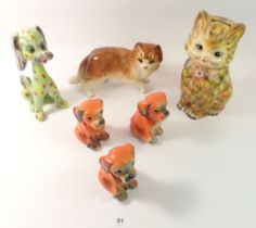 A collection of vintage dog and cat ornaments