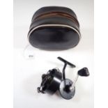 A Mitchell 304 fixed spool fishing reel in pouch