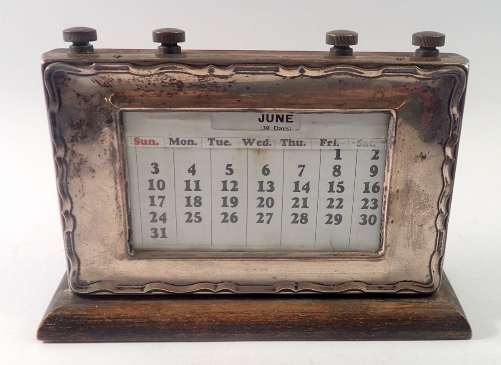 A silver mounted oak desk calendar, Birmingham 1937, 15 x 22cm