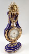 A V&A Marie Antoinette porcelain lyre form mantel clock, 40cm