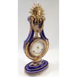 A V&A Marie Antoinette porcelain lyre form mantel clock, 40cm