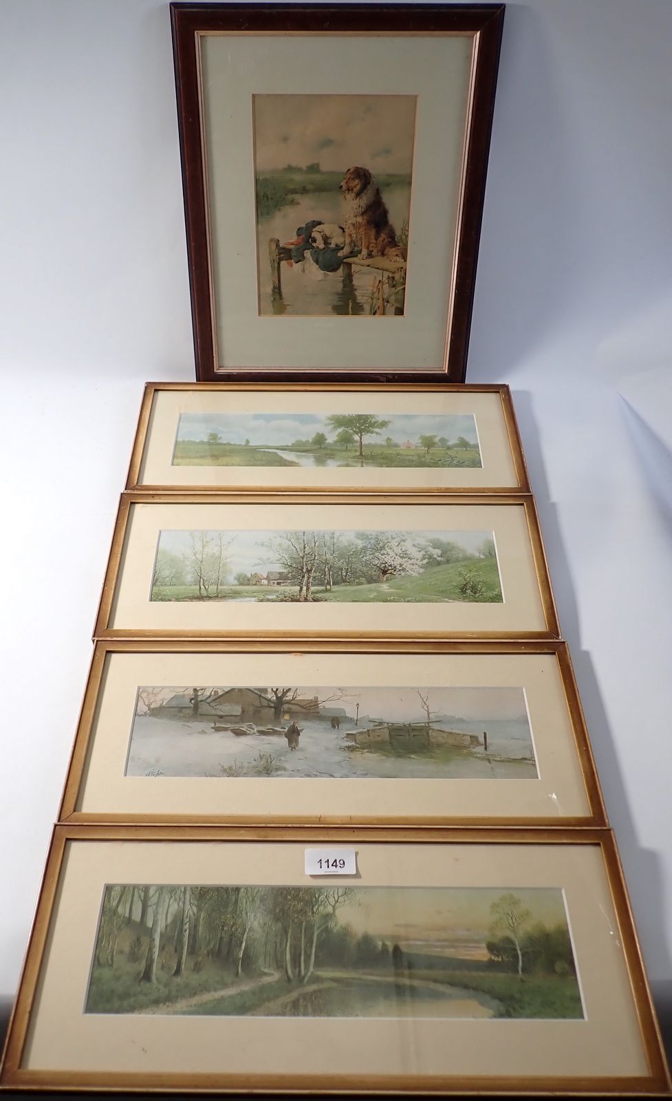 A Victorian chromolithograph two dogs on a jetty, 23 x 16cm and four landscape prints, 9 x 34cm