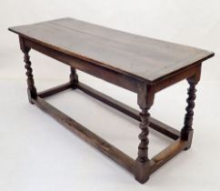 A 17th century small refectory dining table on spiral turned supports united by low stretchers -