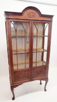 A 1930's oak two door arch top display cabinet, 183cm high x 88cm wide x 33cm deep