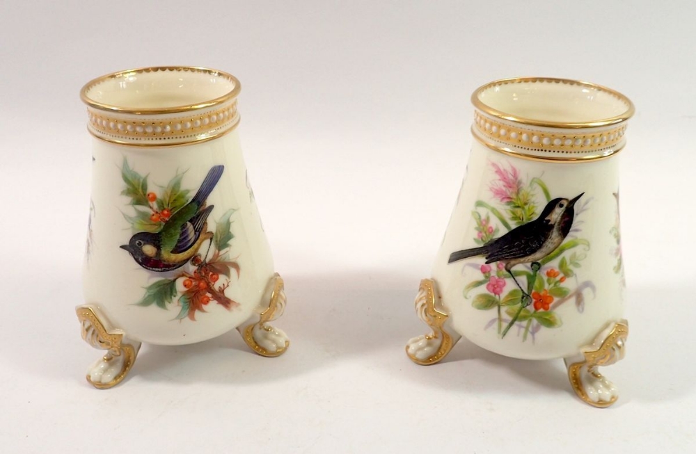 A pair of Royal Worcester vases painted birds in sprays of flowers and berries, by John Hopewell