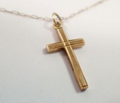 A 9 carat gold crucifix and chain, 1.3g