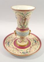 A Minton vase with integral bolted stand painted classical floral swags (star crack to base) 16cm