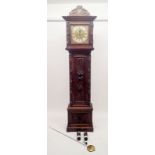 A 19th century continental oak cased longcase clock with square brass dial, the case ornately carved