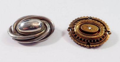 A Victorian oval gold brooch set diamond, 3.7 x 3cm, 9.6g total (unmarked) and a silver oval brooch