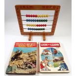 A vintage childs abacus and two 1960's annuals