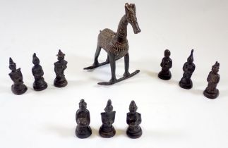 A group of Indian bronze deities and a similar rocking horse, 14cm tall