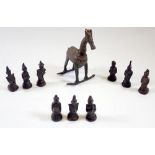 A group of Indian bronze deities and a similar rocking horse, 14cm tall