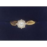 An 18 carat gold illusion set diamond ring, size M, 2.7g