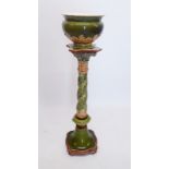 A green Villeroy & Boch Majolica jardiniere and stand decorated mistletoe and leaf decoration,