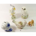 A Crown Staffordshire snowy owl by Linley Adams 19cm high, a parakeet marked Italy, a Beswick lion