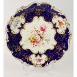 An 'Old Coalport' floral painted plate with blue and gilt ground, 22.5cm