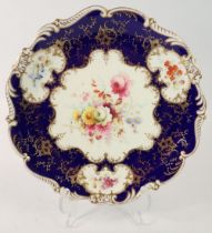 An 'Old Coalport' floral painted plate with blue and gilt ground, 22.5cm