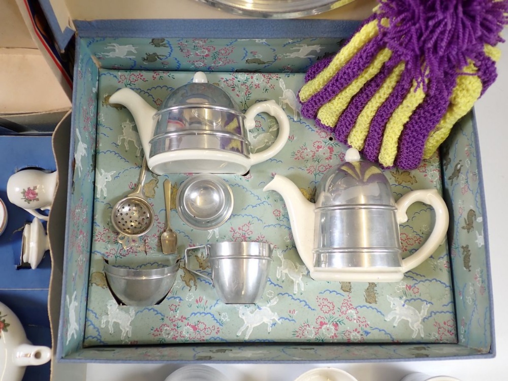 A vintage children's chrome clad pottery tea service, boxed, another part children's tea set,