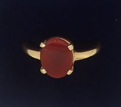 A gold ring set orange stone unmarked but tested as 15ct gold, 2.5g, size N to O