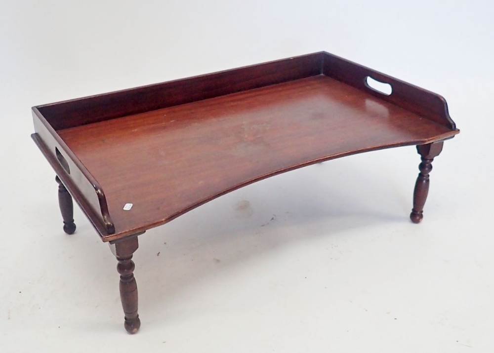 A wooden invalid bed tray