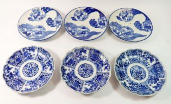 Six Japanese blue and white Imari plates (two riveted) 21cm diameter