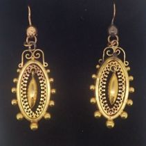 A pair of Victorian oval gold filigree and beaded earrings (converted to hooks) 3.4g