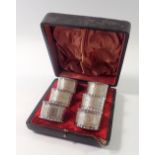 A Victorian set of six silver plated napkin rings decorated leaves, cased