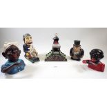 A group of five Victorian style cast iron money boxes including 'Magician Bank' and other characters