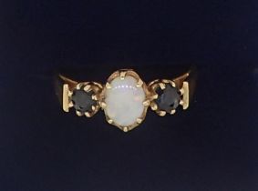 A 9 carat gold opal and sapphire ring, size M, 1.7g