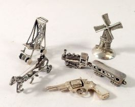 A collection of miniature silver including train, horse & cart, windmill etc. 60.7g total weight