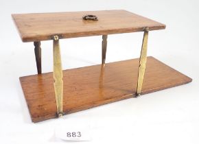 A folding campaign brass and mahogany hanging shelf, 10 x 27cm