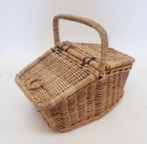 A vintage double sided wicker picnic basket