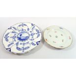 A Meissen plate painted sprigs of flowers, 18cm diameter and a Meissen style blue and white plate