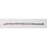 An antique white metal and moonstone bracelet, 16.5cm