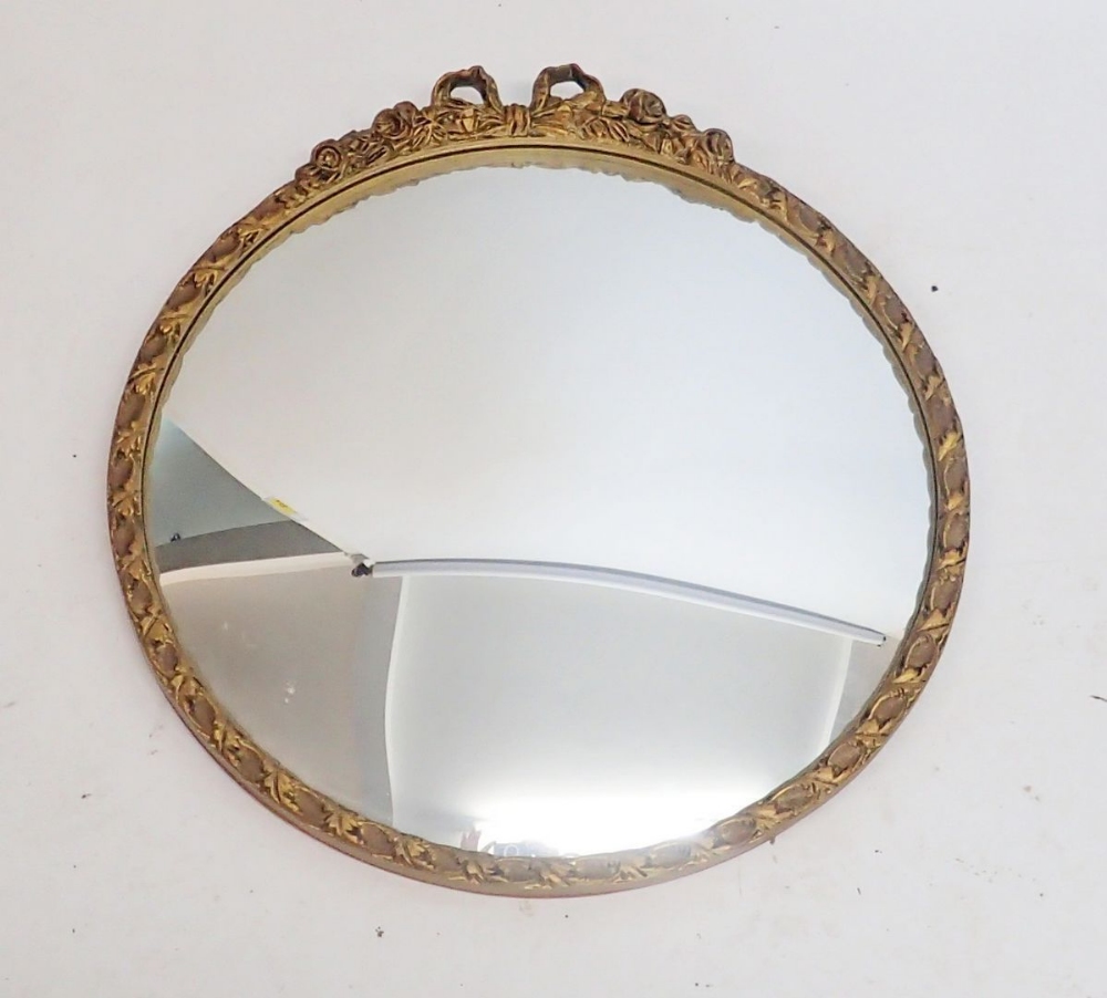 A circular gilt framed convex mirror with ribbon surmount, 48cm