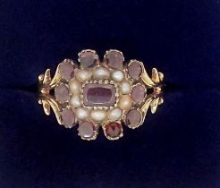 A Victorian 9 carat gold garnet and seed pearl ring, size J, 2.9g, boxed